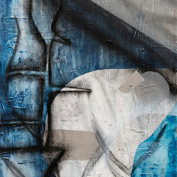 abstract painting with circular features and shaded lines in tones of blue and off-white.