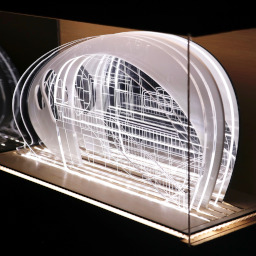 3D geometric acrylic model, dome roof, in a glass case the wooden back under LED lights.