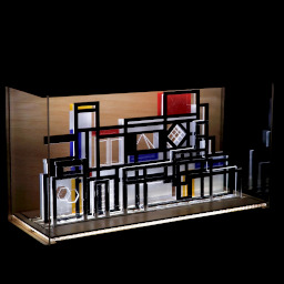 3D geometric acrylic model, various rectangular features and red, blue and yellow features, in a glass case with wooden back under LED lights.