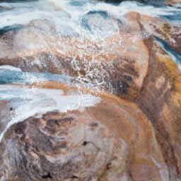 photograph of seaside rocks with water foam effect painted on top.