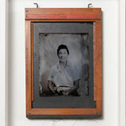 antique black and white portrait, female figure, orange frame.