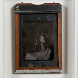 antique black and white portrait, female figure, orange frame.