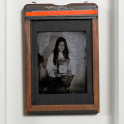 antique black and white portrait, female figure, orange frame.