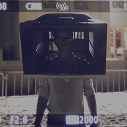 portrait of male figure standing with TV on head, face visible, clear white background.