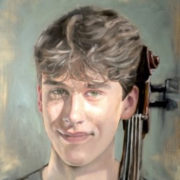 Potrait of a male holding the end of a cello with a blue background