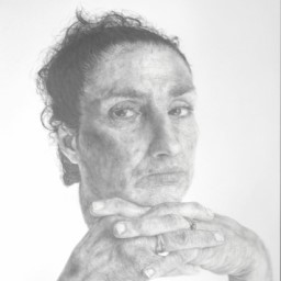 A graphite portrait of a woman resting on her hands