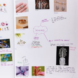 Close up of visual arts diary displaying sketches and photographs for a body of work