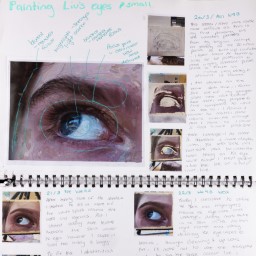 Close up of visual arts diary displaying progress images of eyes for a body of work