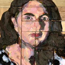 Close up detail of textured painted portrait of a woman in a black and white top with long brown hair on an assembly of toy wooden blocks