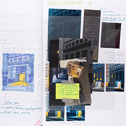 Close up of visual arts diary displaying progress images for a body of work