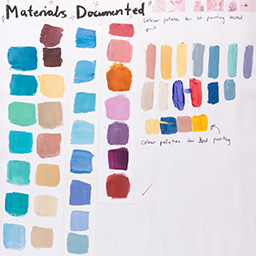 Close up of visual arts diary displaying progress images for a body of work