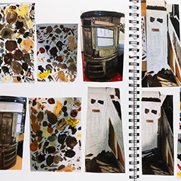 Close up of visual arts diary displaying progress images for a body of work