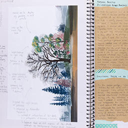 Close up of visual arts diary displaying progress images for a body of work