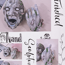 Close up of visual arts diary displaying progress images for a body of work