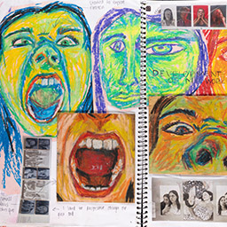 Close up of visual arts diary displaying progress images for a body of work