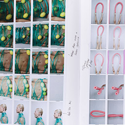 Close up of visual arts diary displaying progress images for a body of work